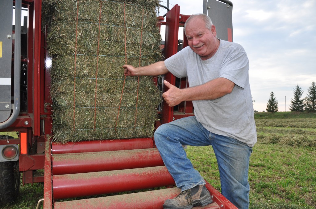 Organic hay farmer Tom Parkins of Alvinston, ON, had a good year, even with the rain and cool weather experienced in southwestern Ontario.  Photo by Owen Roberts