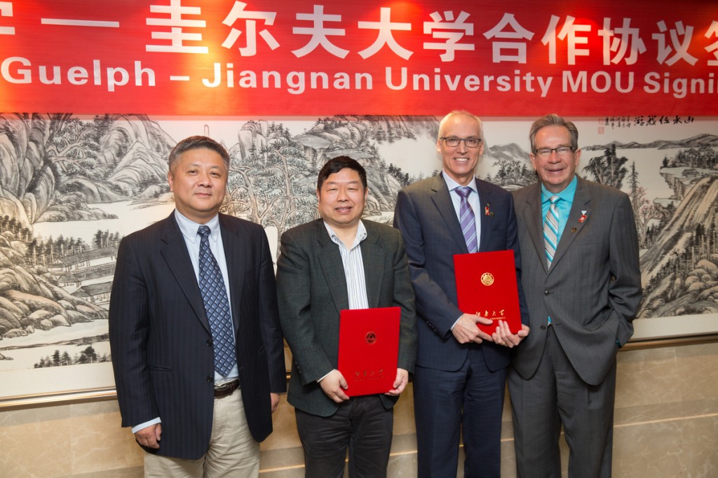 Minister Leal poses with, Dr. Franco J. Vaccarino, president of the university of Guelph and  Jiangnan University officials at a MOU signing between the U of G and JU in Wuxi, China, April 22, 2015.